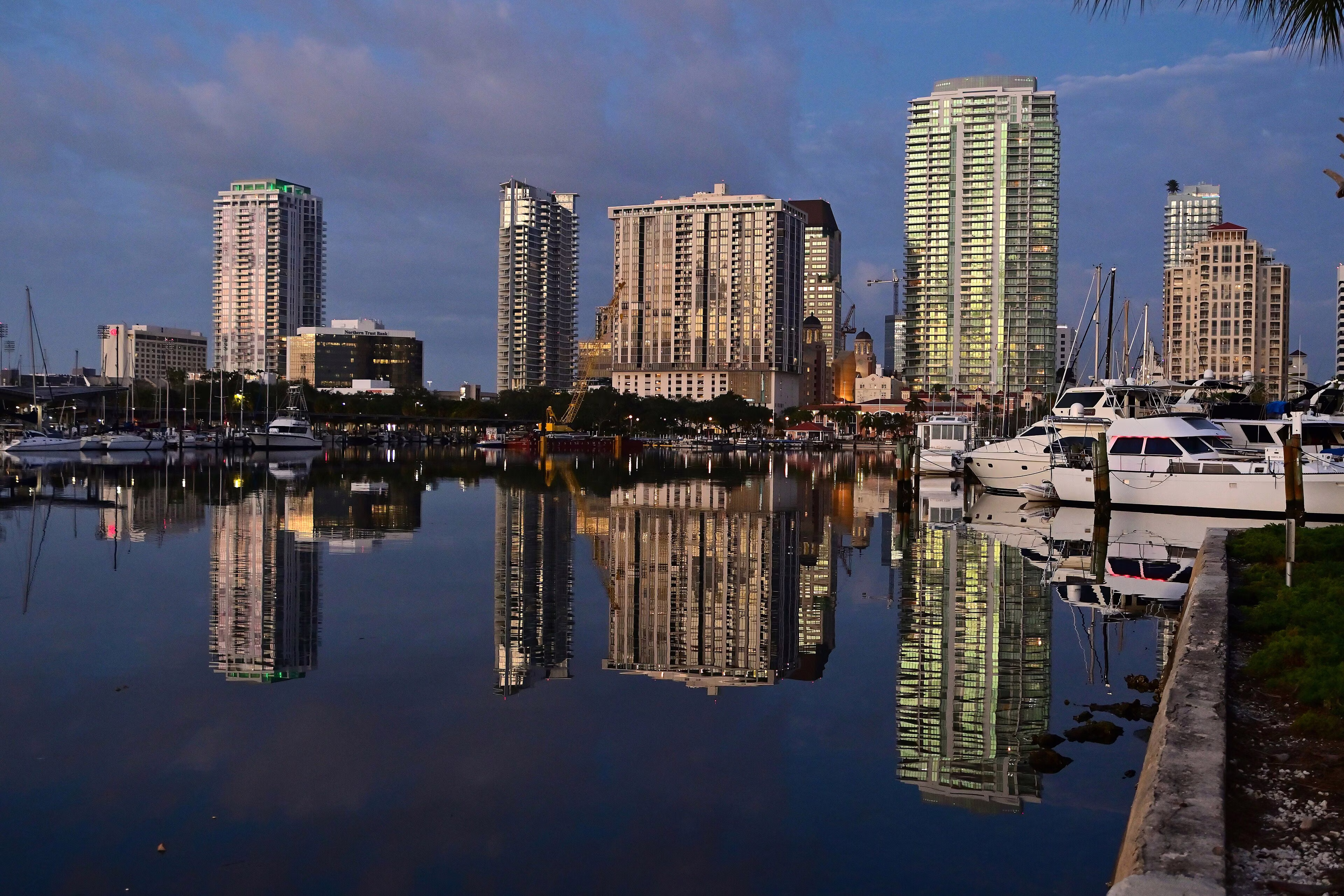 Downtown St. Petersburg, Florida condominium towers reflected in the marina at sunrise