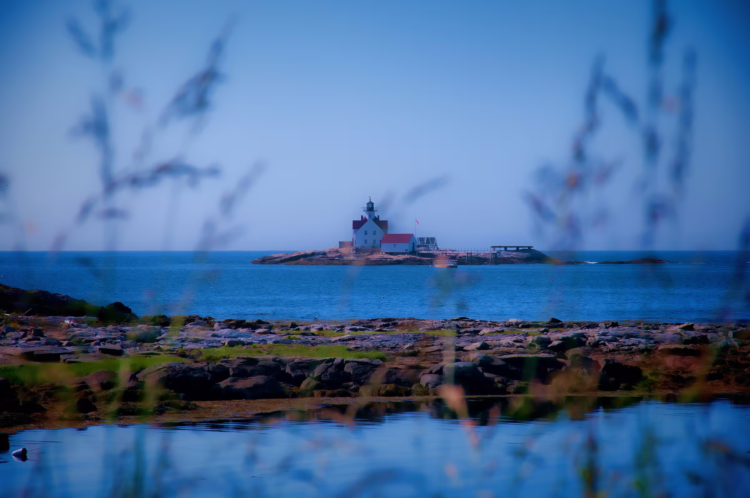 A Maine lighthouse on the coast at dawn